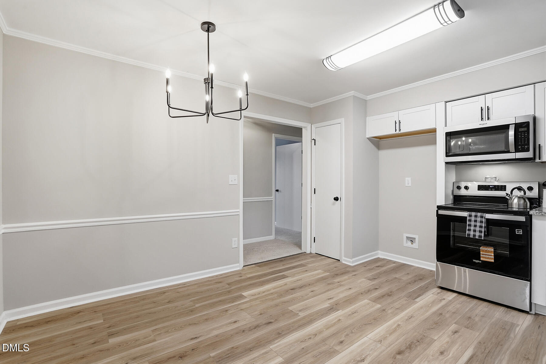 812 Chalk Level Road Durham, NC 27704 - Photo 8 of 31 a kitchen with stainless steel appliances a stove and a refrigerator