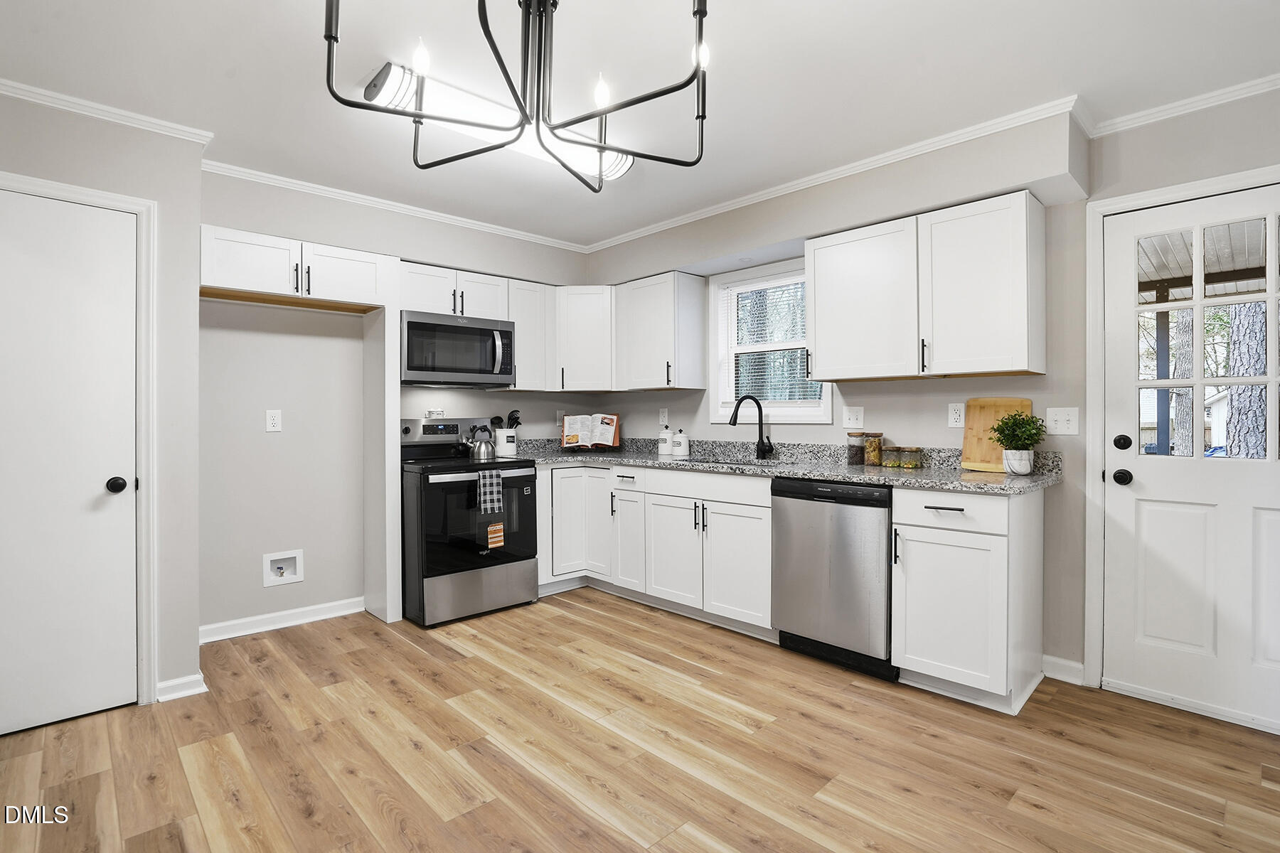 812 Chalk Level Road Durham, NC 27704 - Photo 9 of 31 a kitchen with stainless steel appliances granite countertop a refrigerator a stove a sink and white cabinets with wooden floor