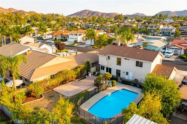 a view of a balcony with table and chairs