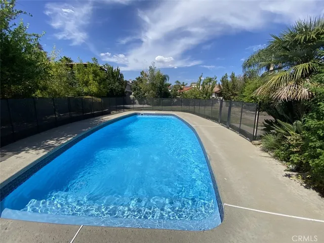 a view of swimming pool with a yard