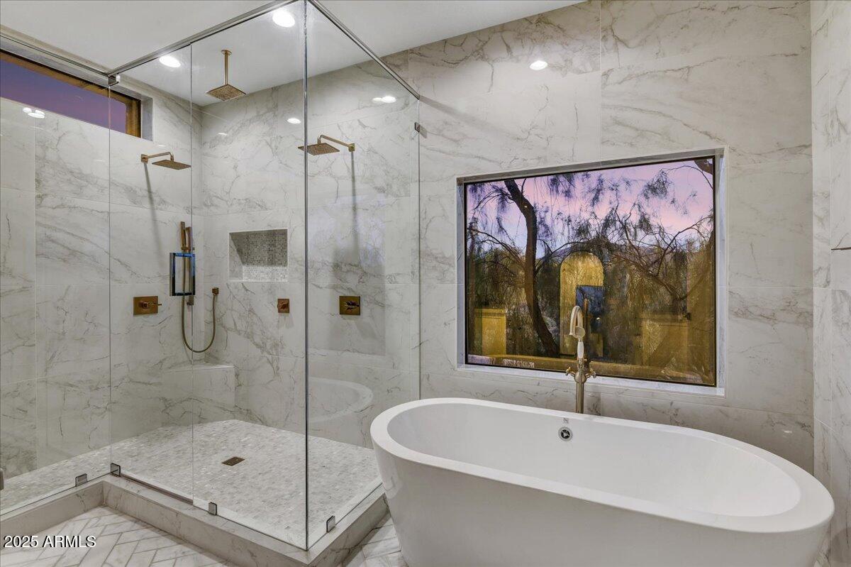 25255 North 90th Way Scottsdale, AZ 85255 - Photo 21 of 41 a bathroom with a bathtub and a shower