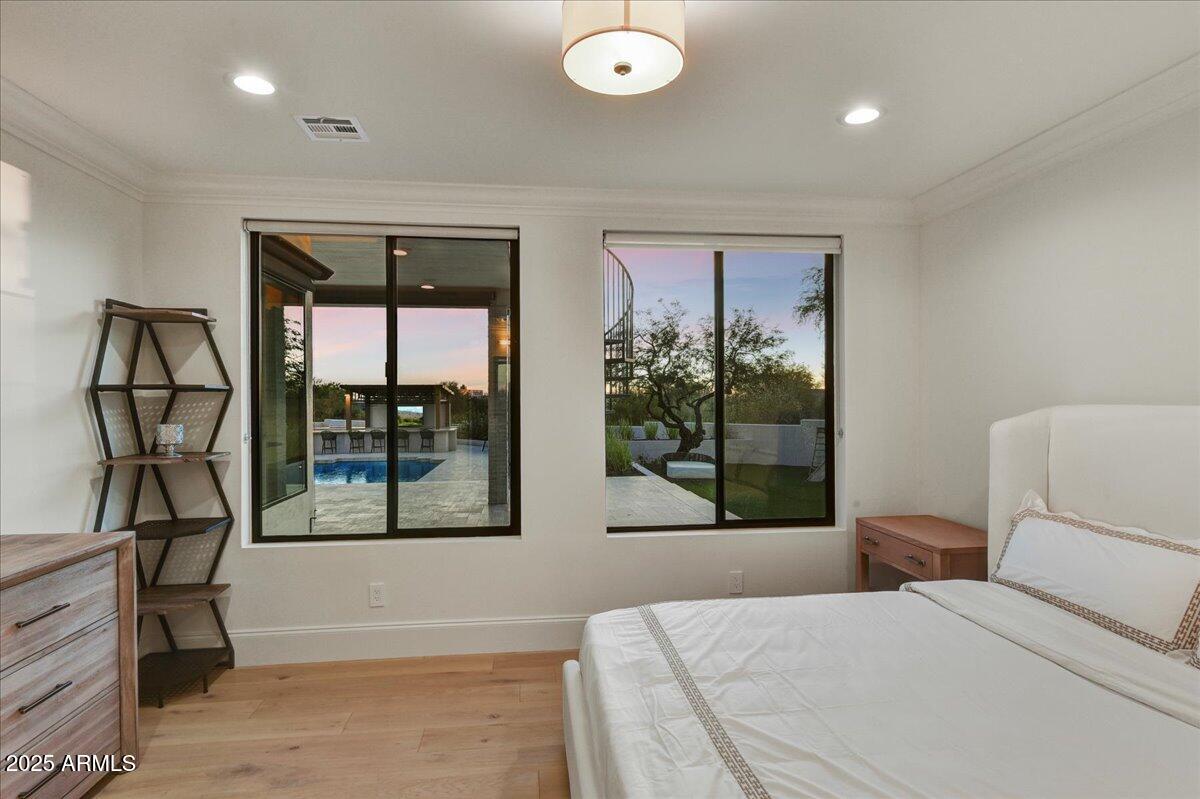 25255 North 90th Way Scottsdale, AZ 85255 - Photo 25 of 41 a bedroom with a large bed and a window