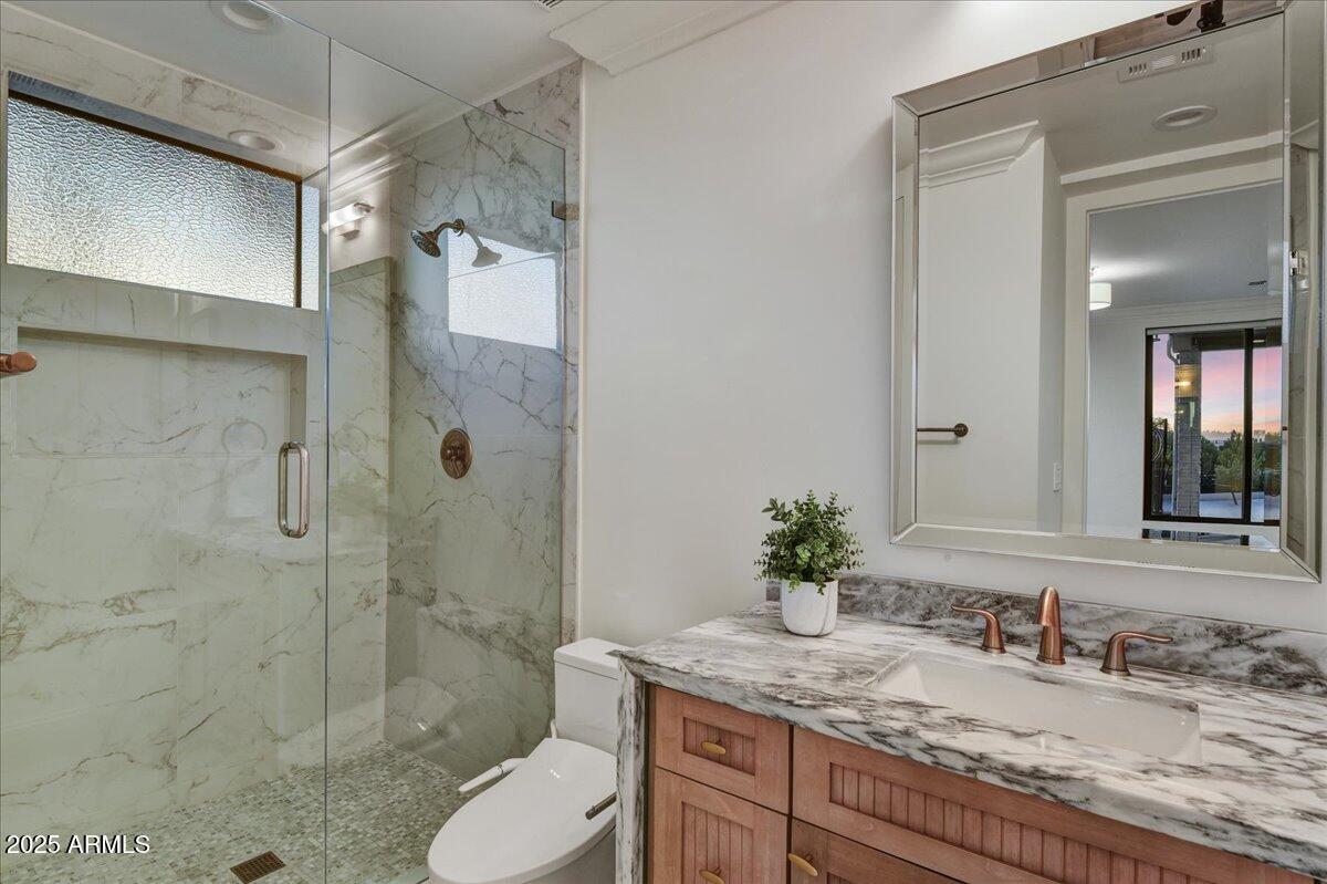 25255 North 90th Way Scottsdale, AZ 85255 - Photo 26 of 41 a bathroom with a granite countertop sink toilet and shower