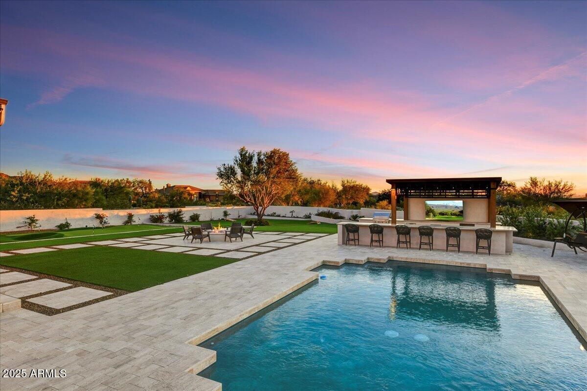 25255 North 90th Way Scottsdale, AZ 85255 - Photo 9 of 41 a view of a swimming pool and outdoor seating