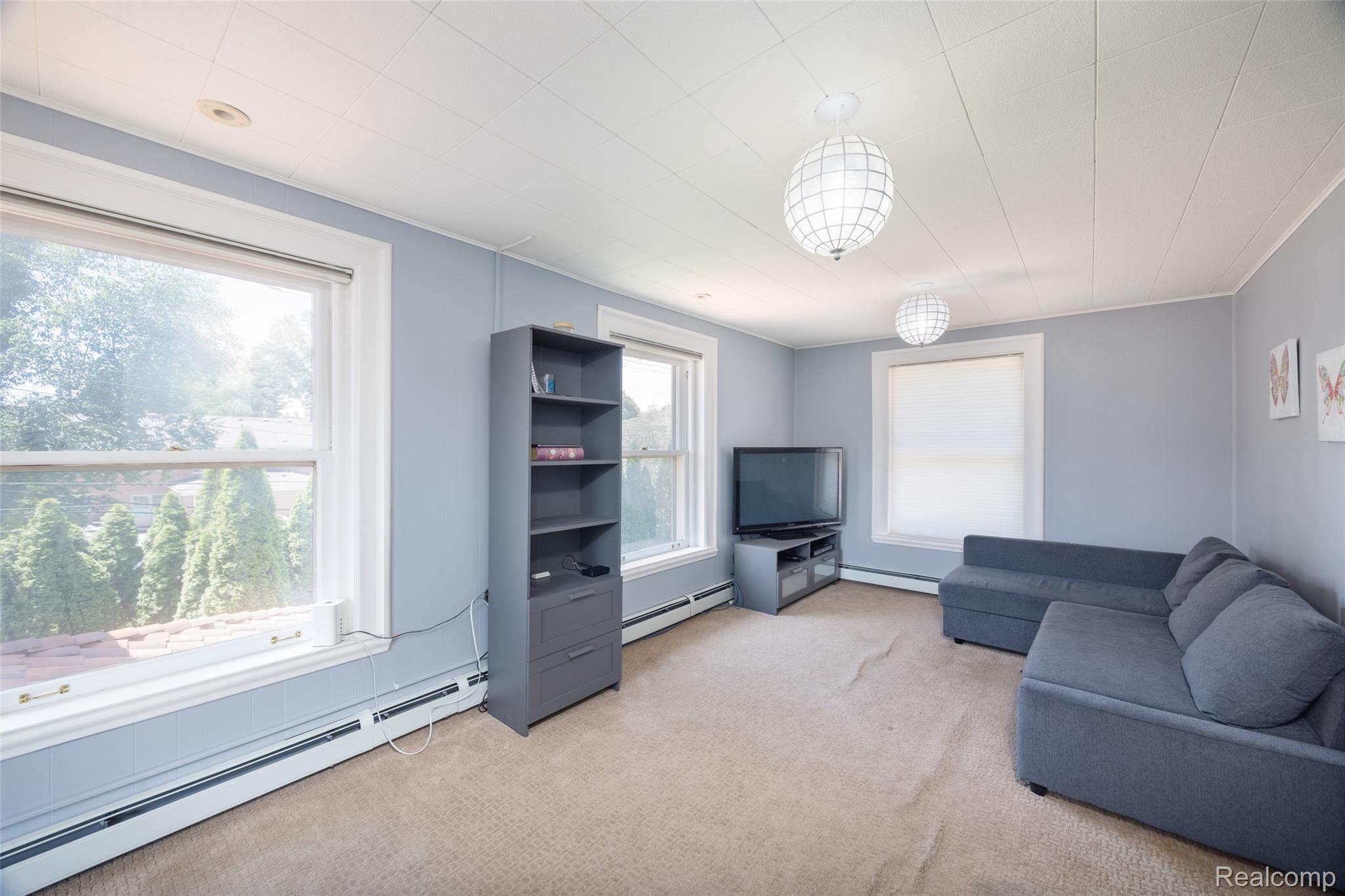 189 Cloverly Road Grosse Pointe, MI 48236 - Photo 60 of 93 The expansive room at the end of the private south wing offers exceptional flexibility as a bedroom, family lounge, media room, or creative workspace.