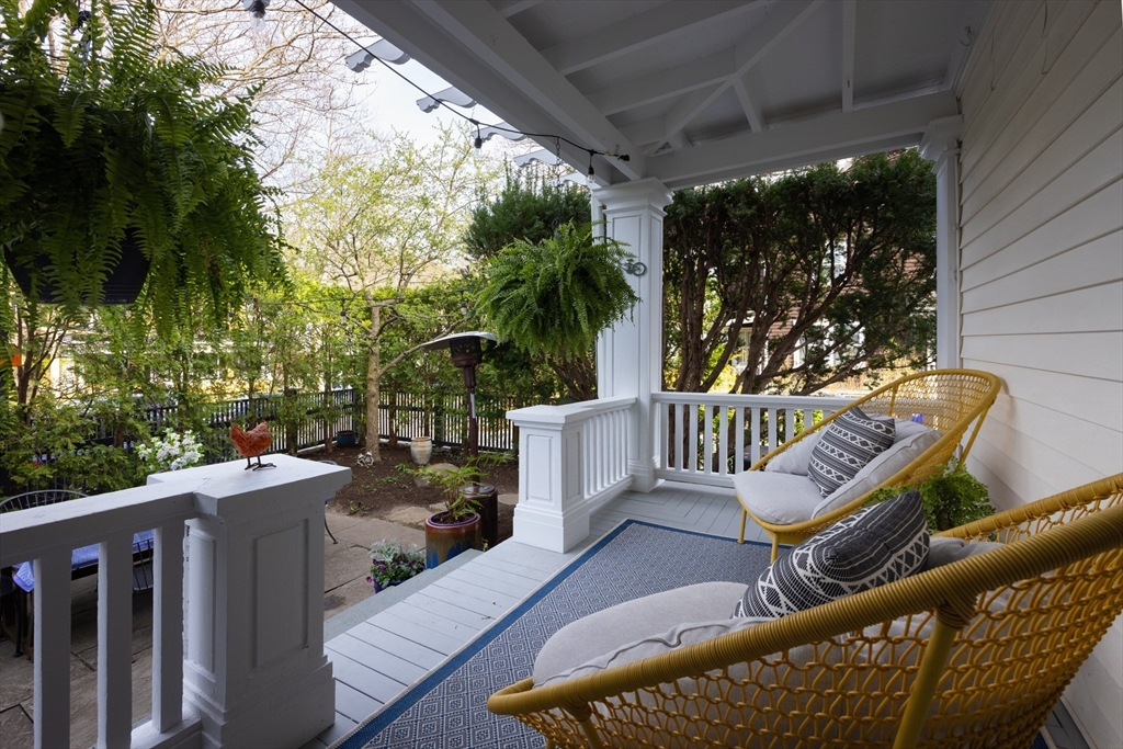 4 Vogel Terrace Brookline, MA 02445 - Photo 2 of 6 a view of a roof deck with wooden fence and glass door