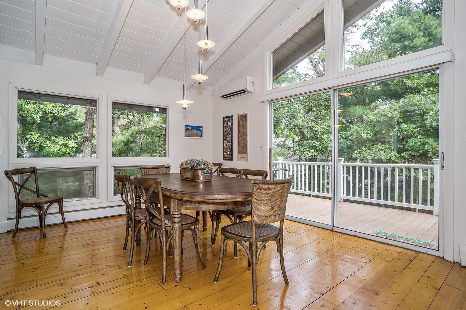 64 Fells Pond Road Mashpee, MA 02649 - Photo 11 of 25 a view of a dining room with furniture window and wooden floor