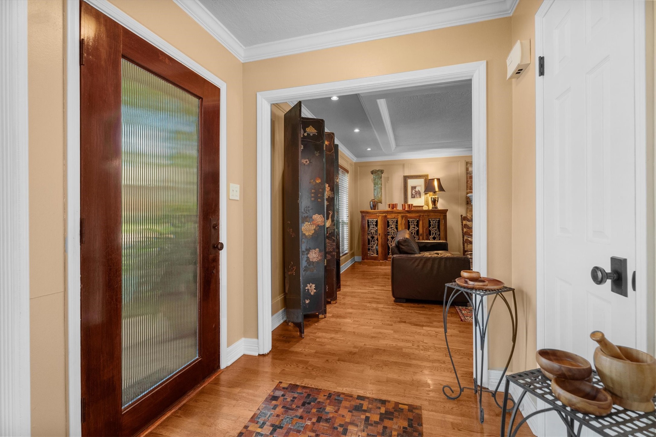 9103 Herts Road Spring, TX 77379 - Photo 5 of 46 Inside, warm, oak wood floors span throughout most of the rooms downstairs. The entry is highlighted with an inlaid wood accent, and opens to the spacious living room.