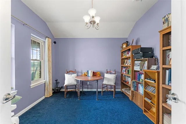 a bedroom with bed and a window