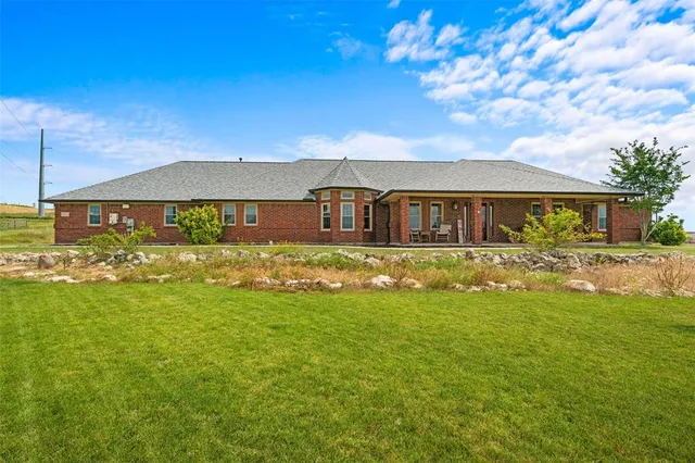 a view of a house with a big yard