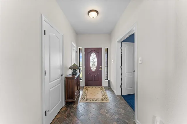 a view of a livingroom with furniture window and fireplace