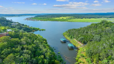 an aerial view of a golf course with houses