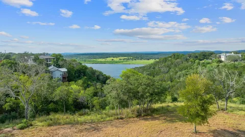 a view of a lake with a yard