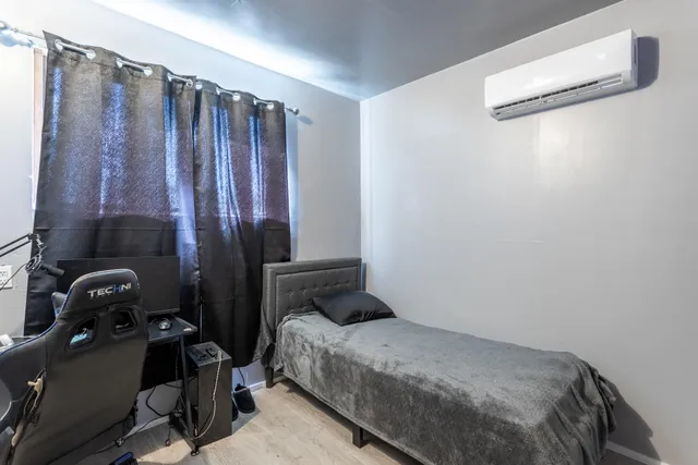 a bedroom with a bed and a closet