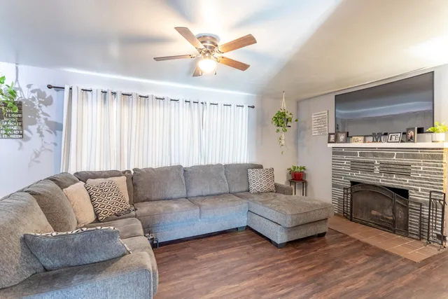 a living room with furniture and a fireplace