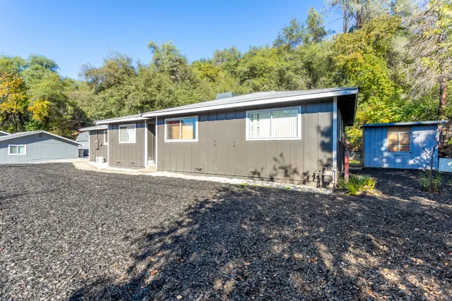 a backyard of a house with lots of green space