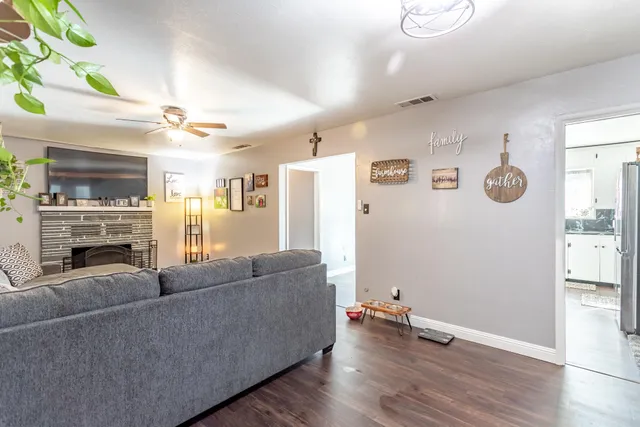 a living room with furniture and a fireplace