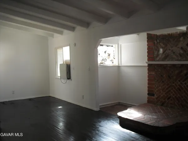 a view of wooden floor in an empty room