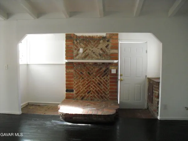 a view of wooden floor in an empty room