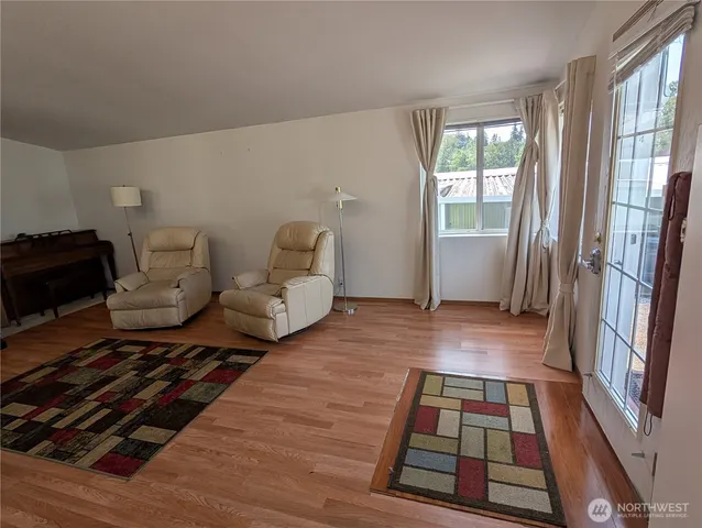 a living room with furniture and a rug