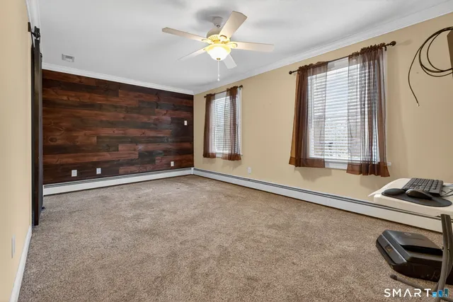 a room with window and a ceiling fan