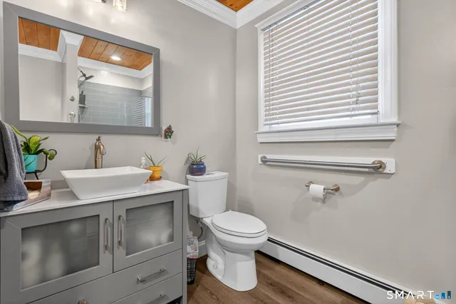 a view of a bedroom with washer and dryer