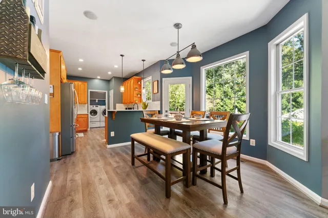 a view of a dining room with furniture window and outside view
