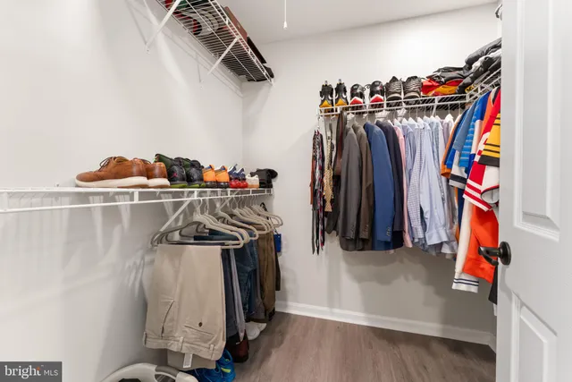 a bed room with a bed and a chair