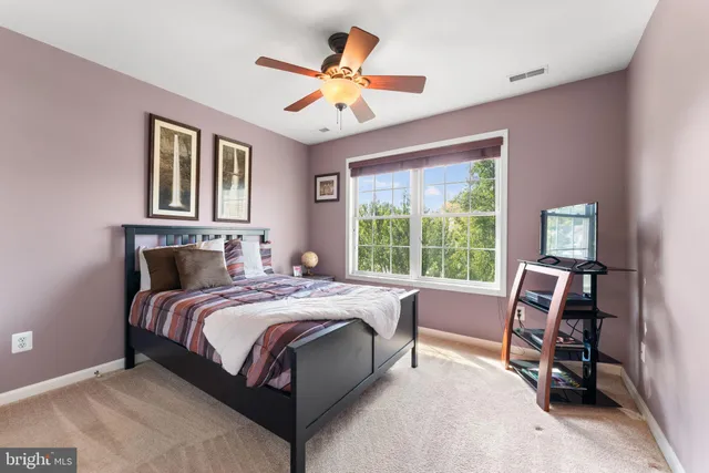 a room with furniture pool table and windows