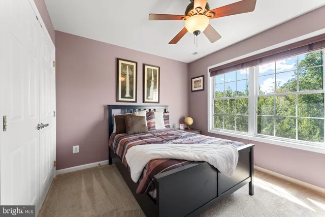 a living room with furniture a rug and a flat screen tv
