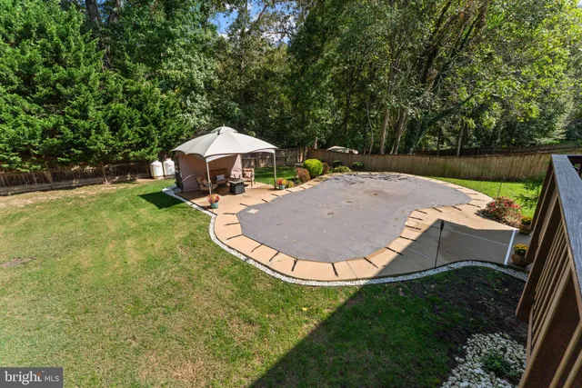 a front view of a house with a garden and plants