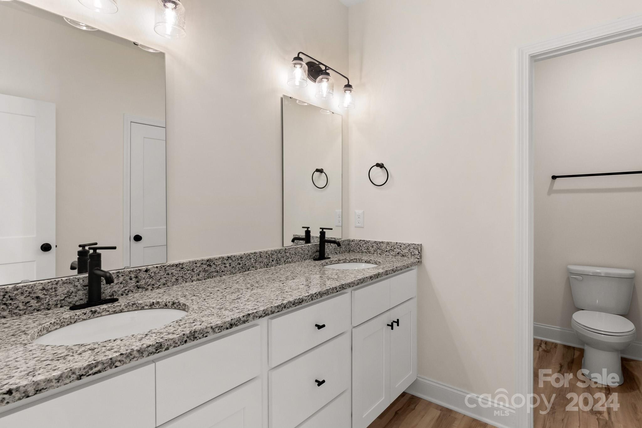 541 Rutledge Drive Catawba, SC 29704 - Photo 22 of 36 a bathroom with a granite countertop sink and a mirror