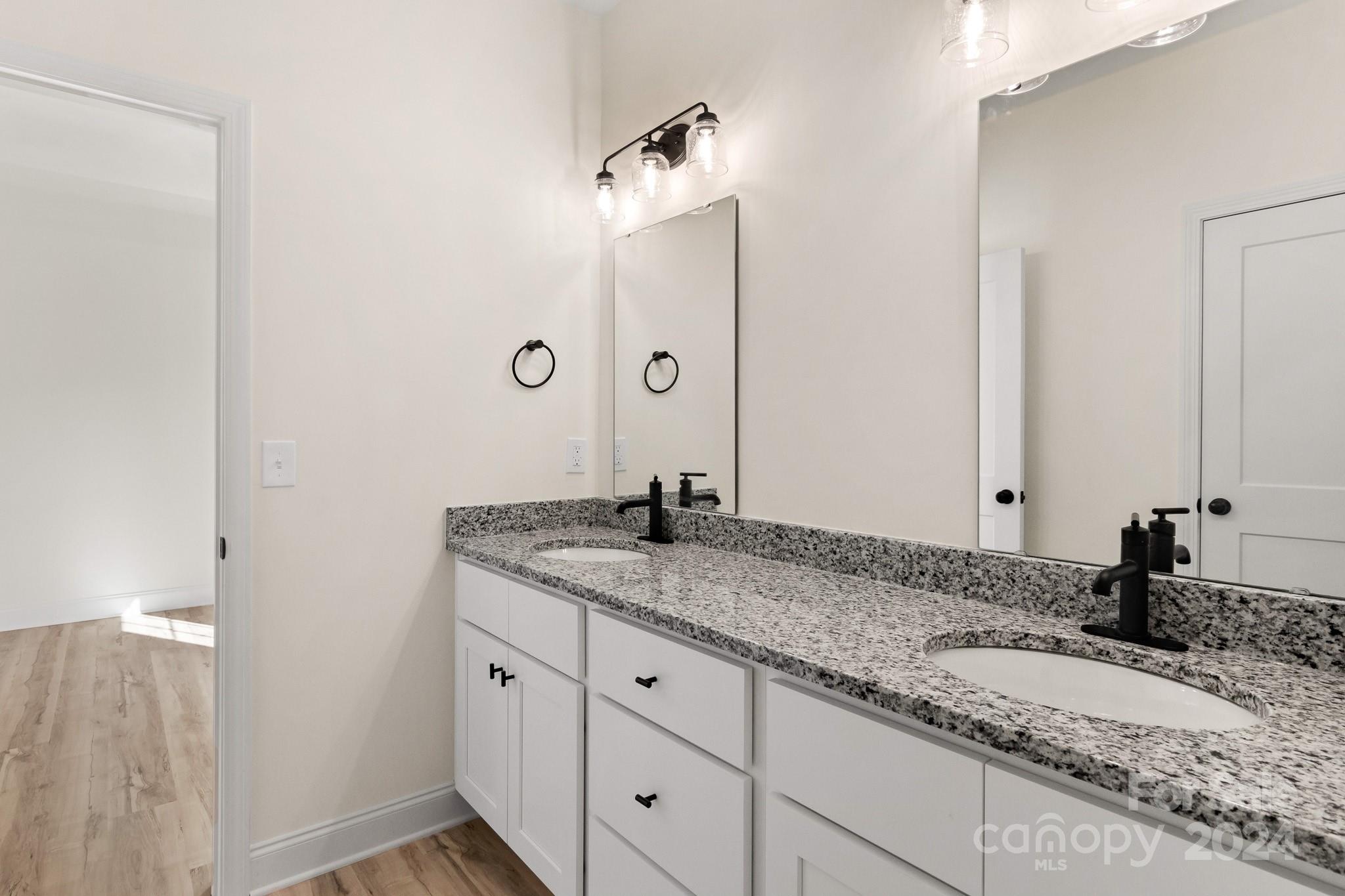 541 Rutledge Drive Catawba, SC 29704 - Photo 23 of 36 a bathroom with a granite countertop sink and a mirror