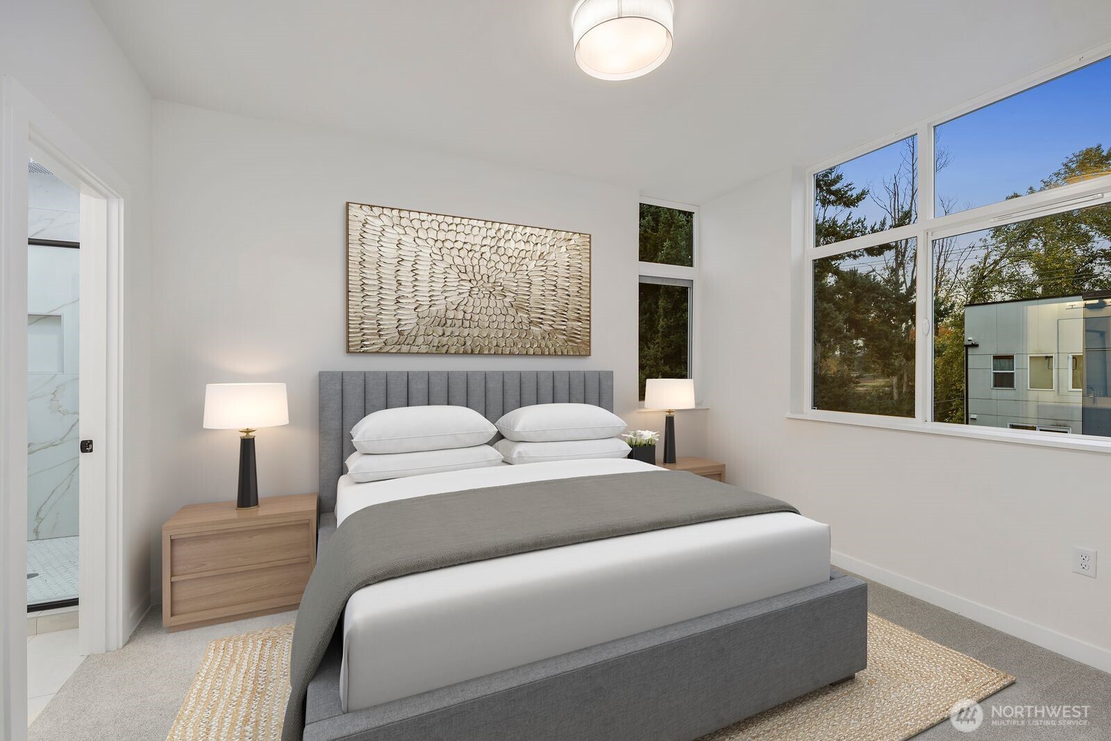 548 South Cloverdale Street, Unit D Seattle, WA 98108 - Photo 16 of 40 a bedroom with a large bed and a window