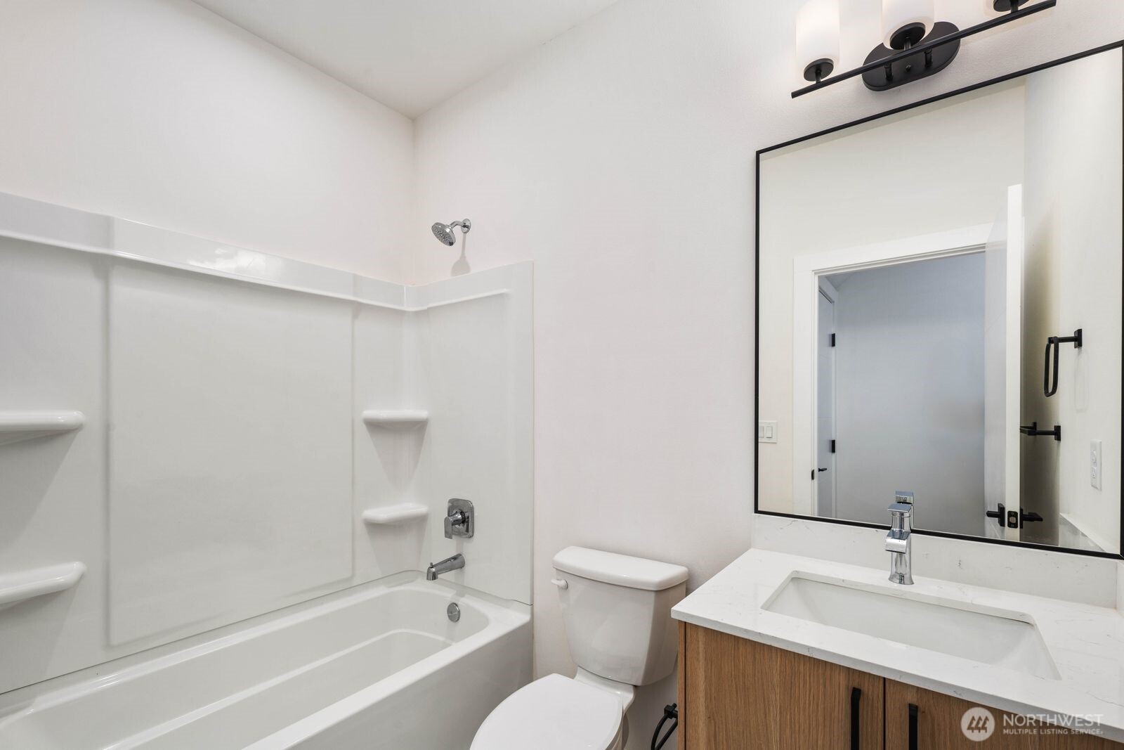 548 South Cloverdale Street, Unit D Seattle, WA 98108 - Photo 20 of 40 a bathroom with a sink and a mirror