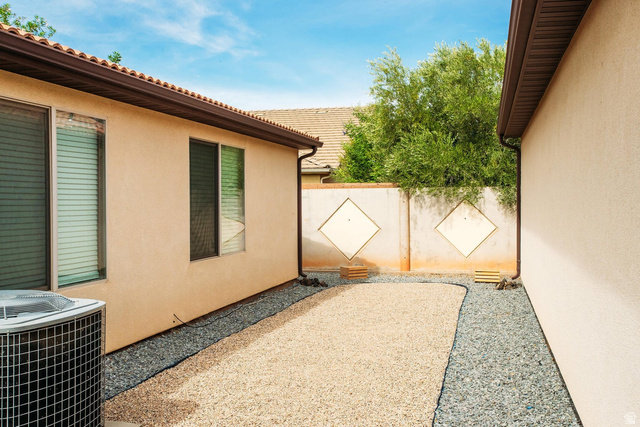 1330 North Dixie Downs Road, Unit 72 St. George, UT 84770 - Photo 2 of 21 View of property exterior with a central AC unit and stucco siding