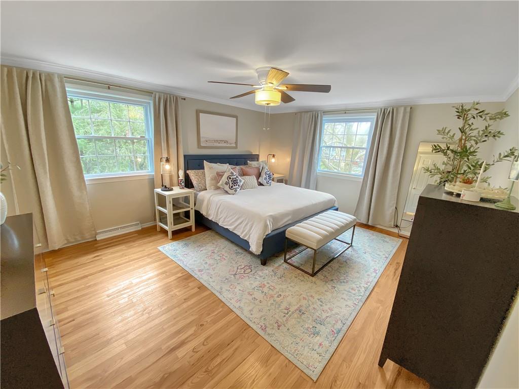 108 Lamar Road Pittsburgh, PA 15241 - Photo 18 of 40 The master bedroom is accented with crown moldings and hardwood flooring.