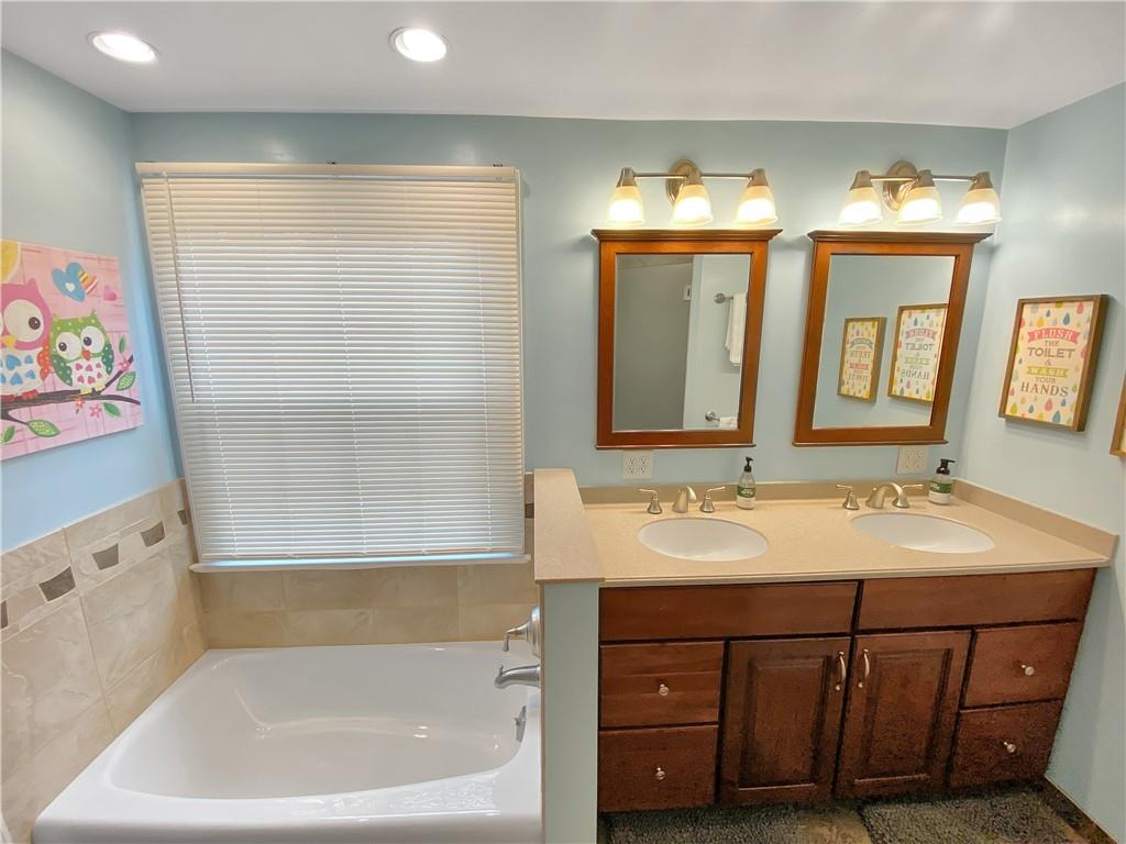 108 Lamar Road Pittsburgh, PA 15241 - Photo 25 of 40 An updated and spacious main bath has a double bowl vanity sink.