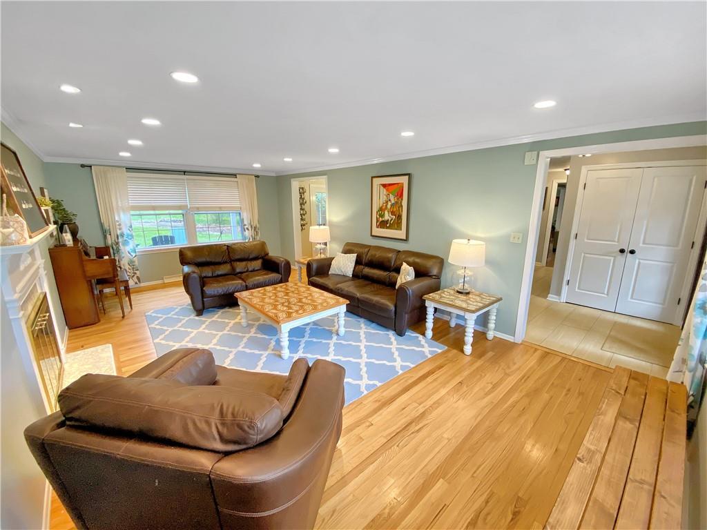 108 Lamar Road Pittsburgh, PA 15241 - Photo 4 of 40 Large living room with hardwood floors, crown moldings, and recessed lights.