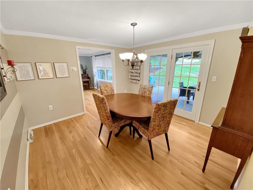 108 Lamar Road Pittsburgh, PA 15241 - Photo 7 of 40 The dining room also features crown moldings and hardwood floors. There is a French door leading to the rear patio.