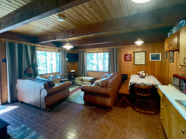 a bedroom with furniture and a window