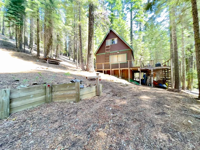 a view of a two chairs in the patio