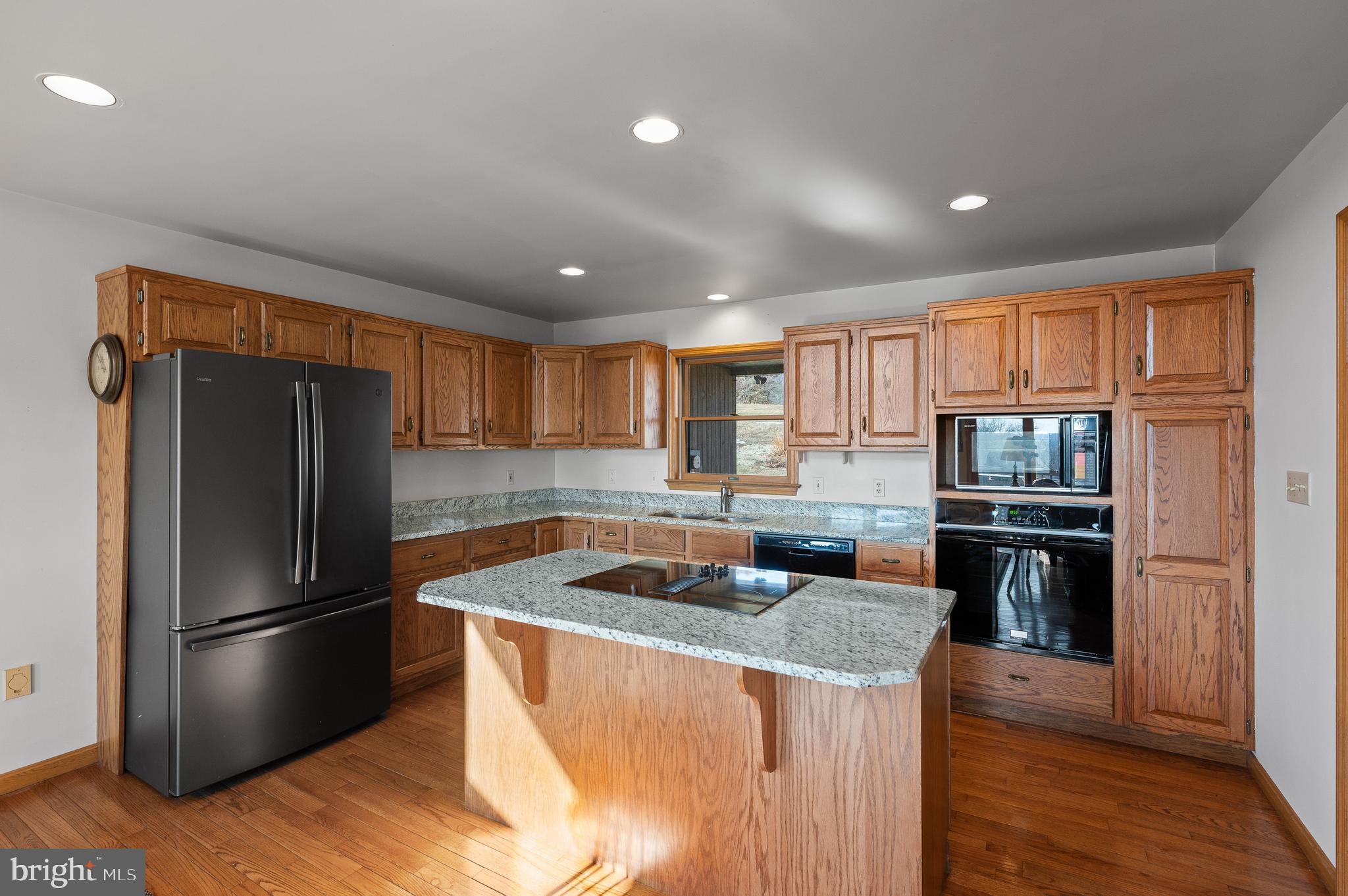 261 Kirks Mill Road Nottingham, PA 19362 - Photo 17 of 32 a kitchen with stainless steel appliances granite countertop a refrigerator stove and oven