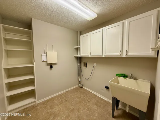 a view of cabinets and workspace