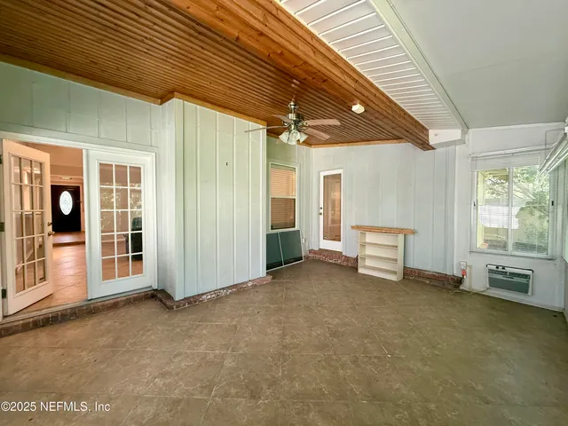 en empty room with windows