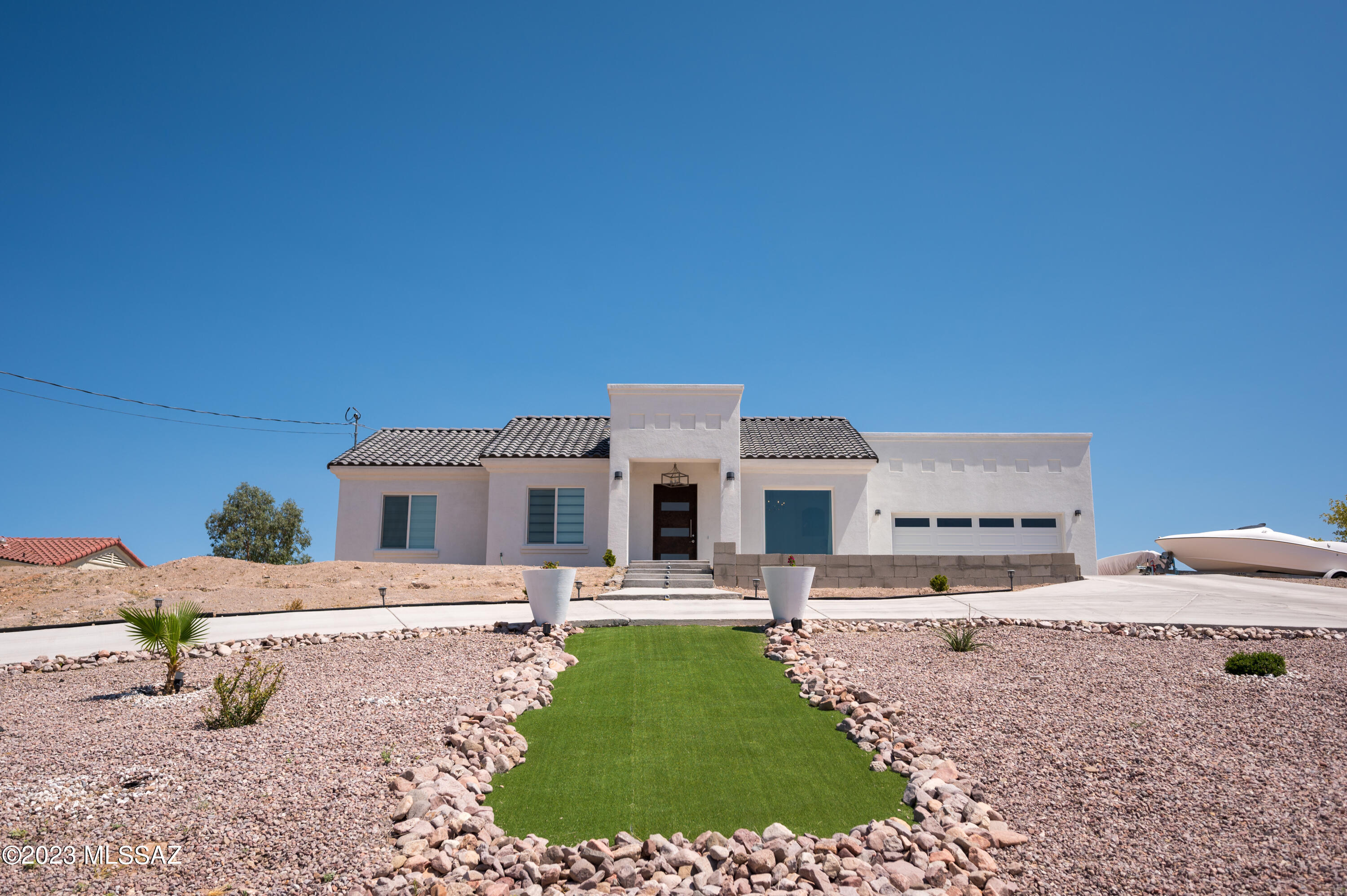 94 Back Nine Terrace Rio Rico, AZ 85648 - Photo 1 of 43 a front view of a house with garden