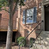 wooden floor in a hall with an empty room