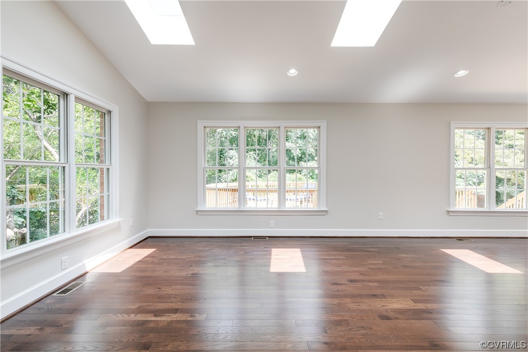 14221 West Salisbury Road Midlothian, VA 23113 - Photo 15 of 43 a view of an empty room with wooden floor and a window