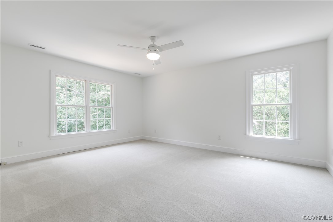 14221 West Salisbury Road Midlothian, VA 23113 - Photo 21 of 43 an empty room with a window and ceiling fan