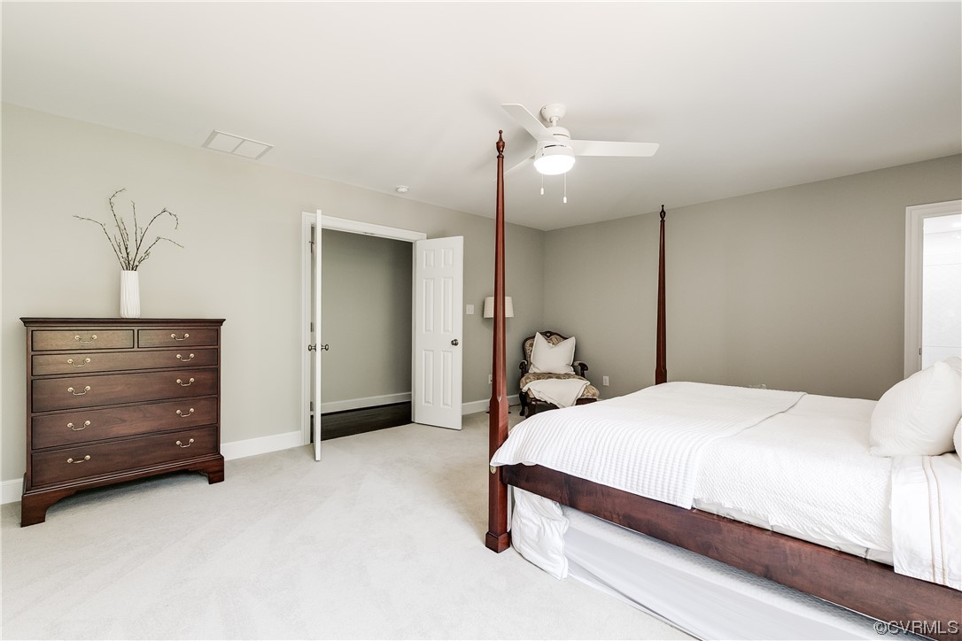 14221 West Salisbury Road Midlothian, VA 23113 - Photo 27 of 43 a bedroom with a bed and a cabinets